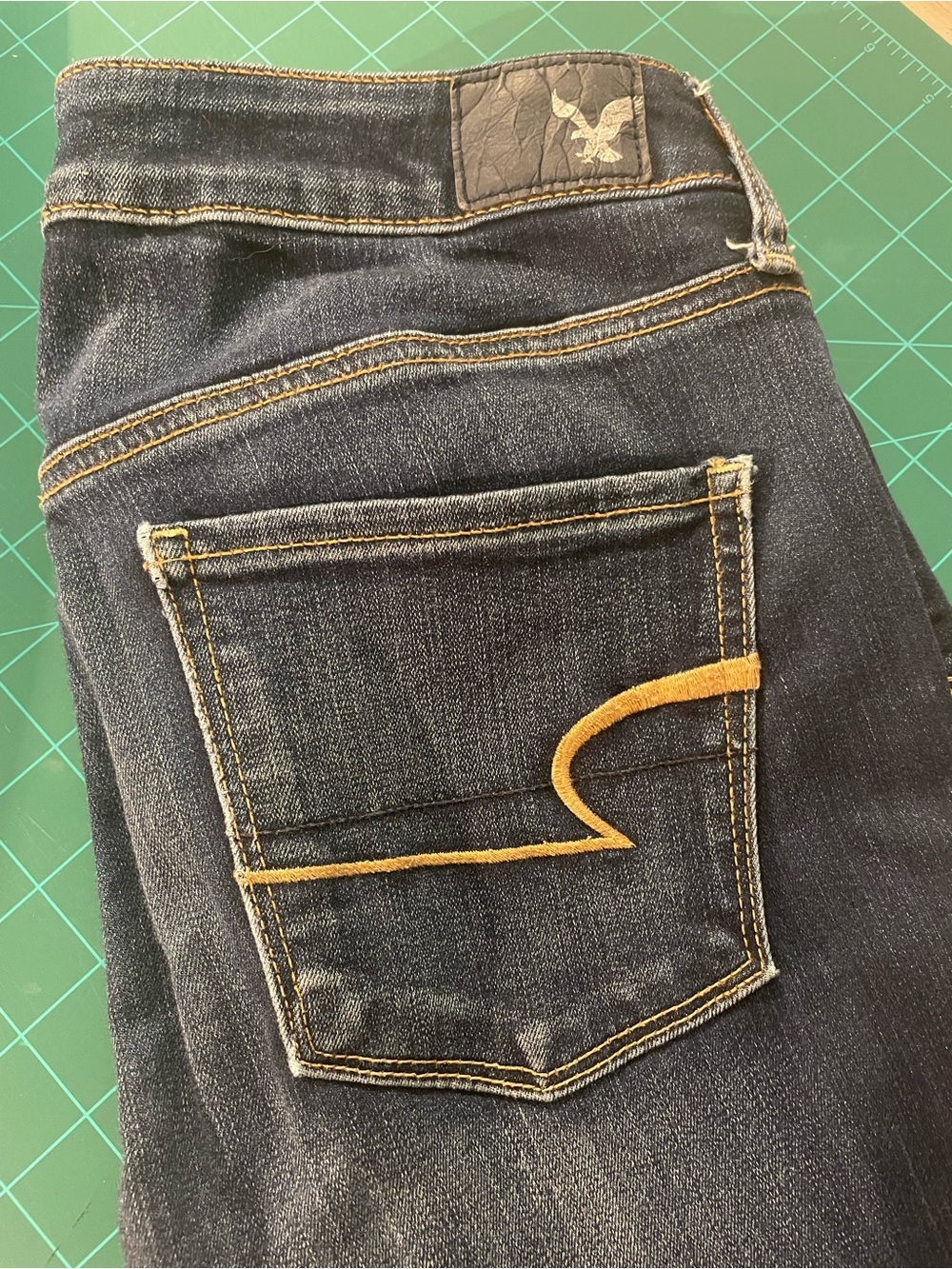 American Eagle Outfitters Dark Blue Skinny Jeans with Gold Stitching